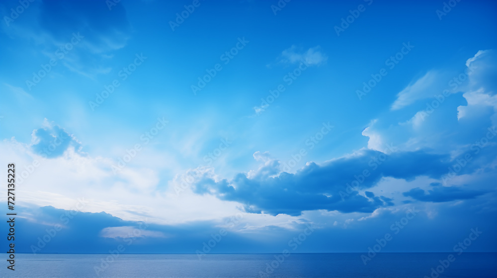 Ocean, sky and blue clouds on the horizon
