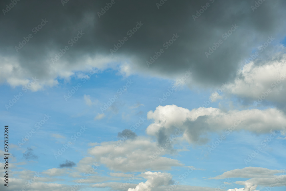 Obraz premium A terrible black cloud hangs in the sky before the rain. Bad weather. Hurricane and thunder over the city. Climate change and natural disasters. Bad mood and despondency.