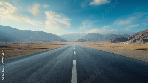 Empty desert road and city