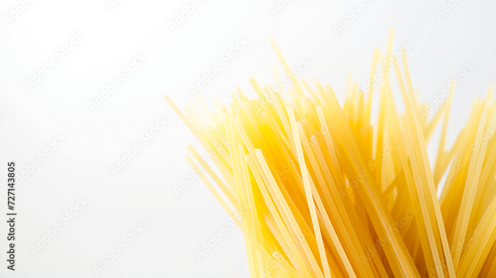Raw spaghetti noodles arranged neatly in a bowl