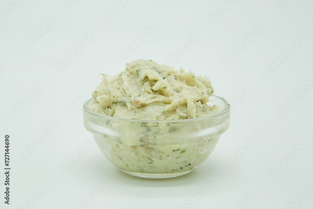 A mixture of fat and spices for sandwiches. The product is ready to use. White background. A mixture of fat and spices for sandwiches. The product is ready to use. White background.