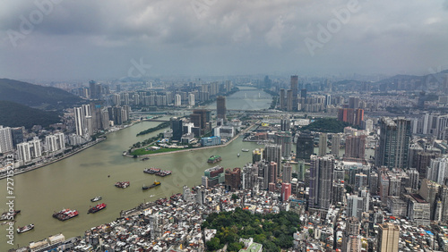 Aerial View of City With River Running Through © Dave