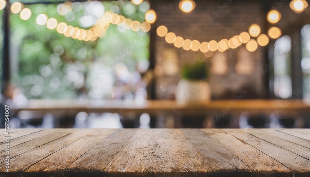 empty old wood table top and blurred bokeh cafe and coffee shop ...