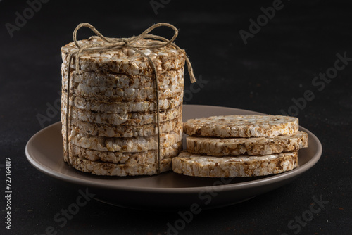 Crunchy rice cakes on dark background. Healthy lifestyle concept.
