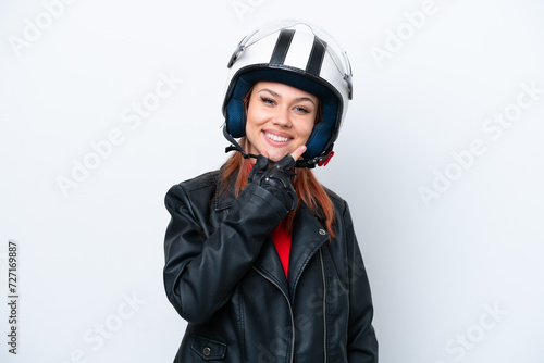 Young Russian girl with a motorcycle helmet isolated on white background happy and smiling
