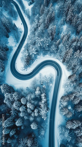 Aerial view of the winding Snake Road in winter in the Dolomite Alps of Italy © Nicola