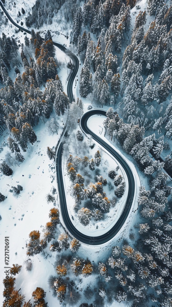 Aerial view of the winding Snake Road in winter in the Dolomite Alps of Italy
