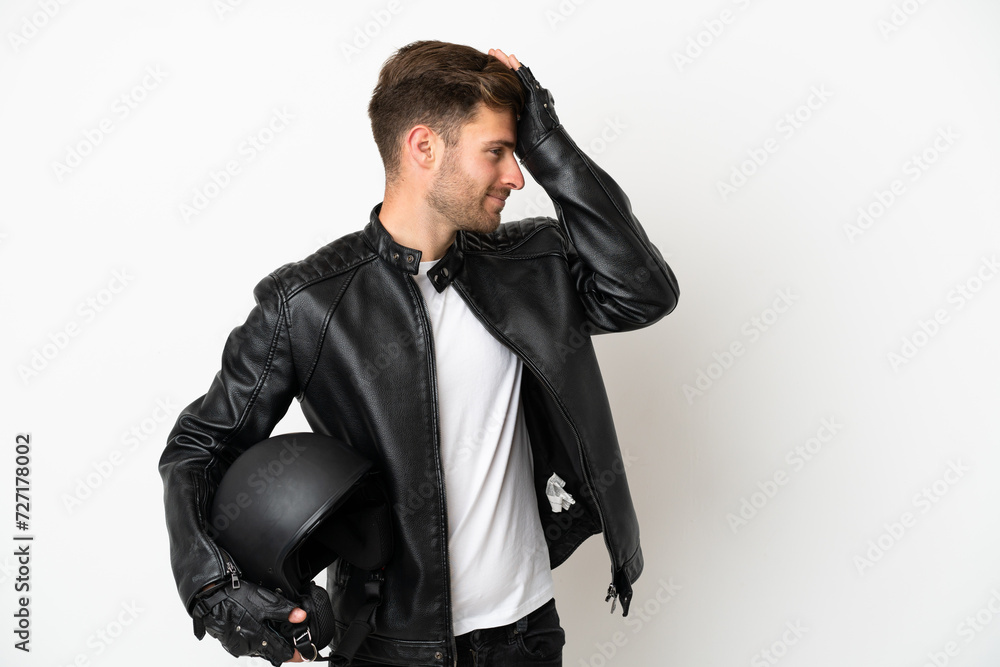 Young caucasian man with a motorcycle helmet isolated on white background has realized something and intending the solution Young caucasian man with a motorcycle helmet isolated on white background has realized something and intending the solution