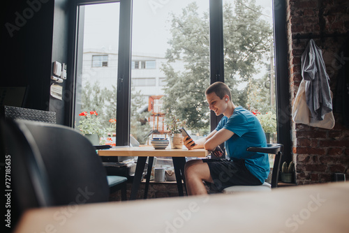 Young Student Enjoying Coffee and Browsing Social Media on Sunny Day