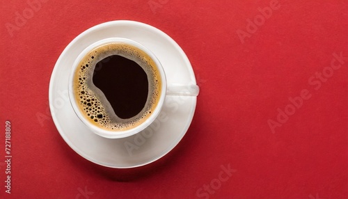 top view of white cup with fresh coffee on saucer on red background panoramic shot