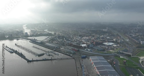 Delfzijl city and one of the administrative centers of the municipality of Eemsdeltain the Dutch province of Groningen. Large industrial port in the north of the Netherlands. Birds eye view. photo