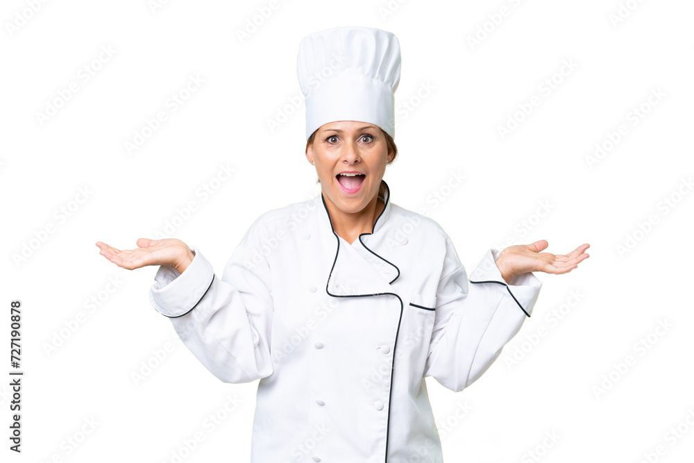 Middle-aged chef woman over isolated background with shocked facial expression Middle-aged chef woman over isolated background with shocked facial expression