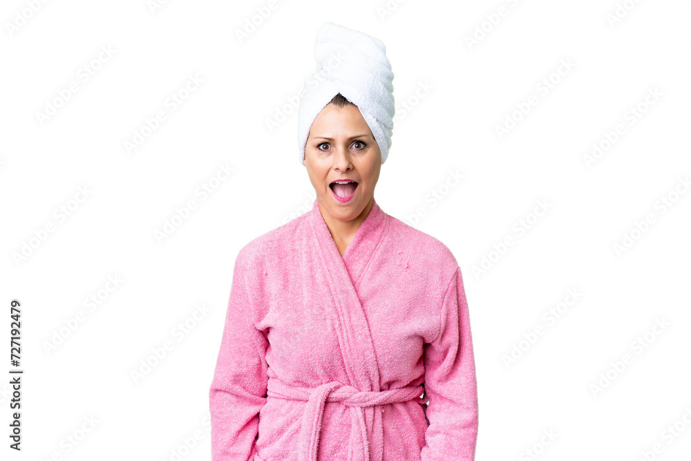 Middle age caucasian woman in a bathrobe over isolated background with surprise facial expression Middle age caucasian woman in a bathrobe over isolated background with surprise facial expression