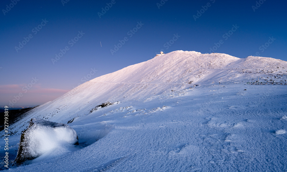 Sniezka mountain at dusk during winter in Giant mountains