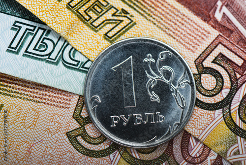 Money. One russian rubles coin and roubles banknotes