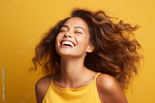Vibrant Joy Portrait of the vibrant joy of a young woman, her smiling pose radiating happiness against a bright wall orange background. Generative AI.