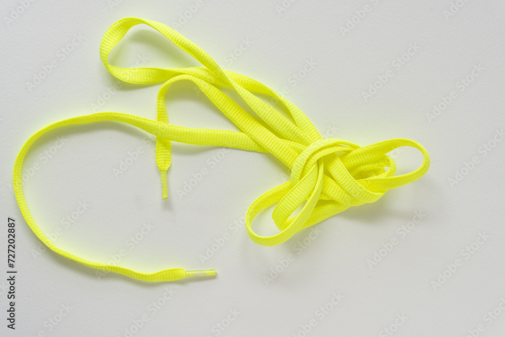 slightly grungy neon yellow lace on blank paper slightly grungy neon yellow lace on blank paper