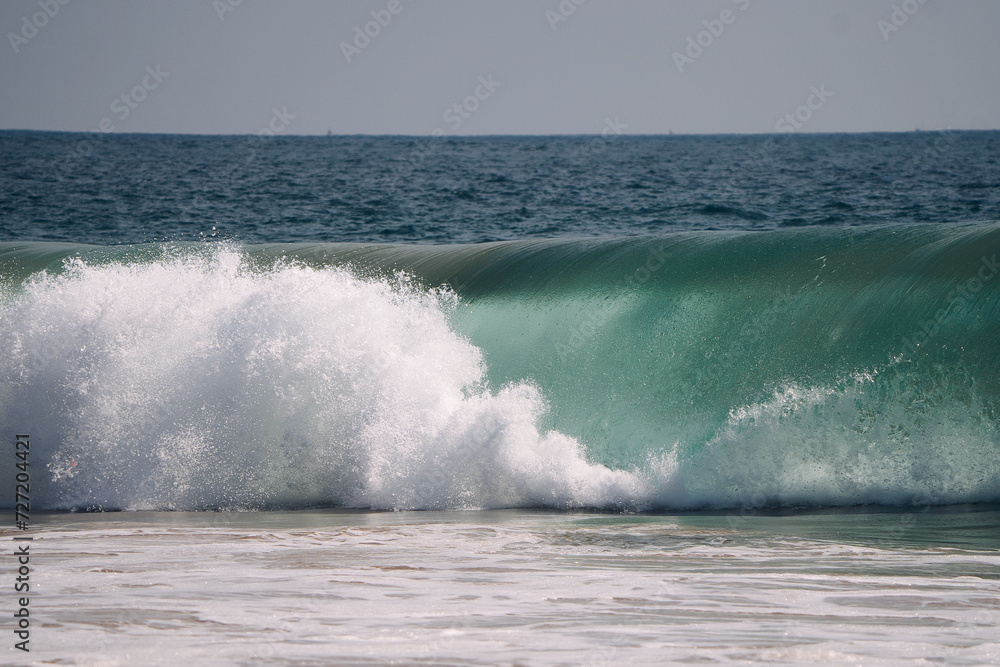 wave breaking on the beach