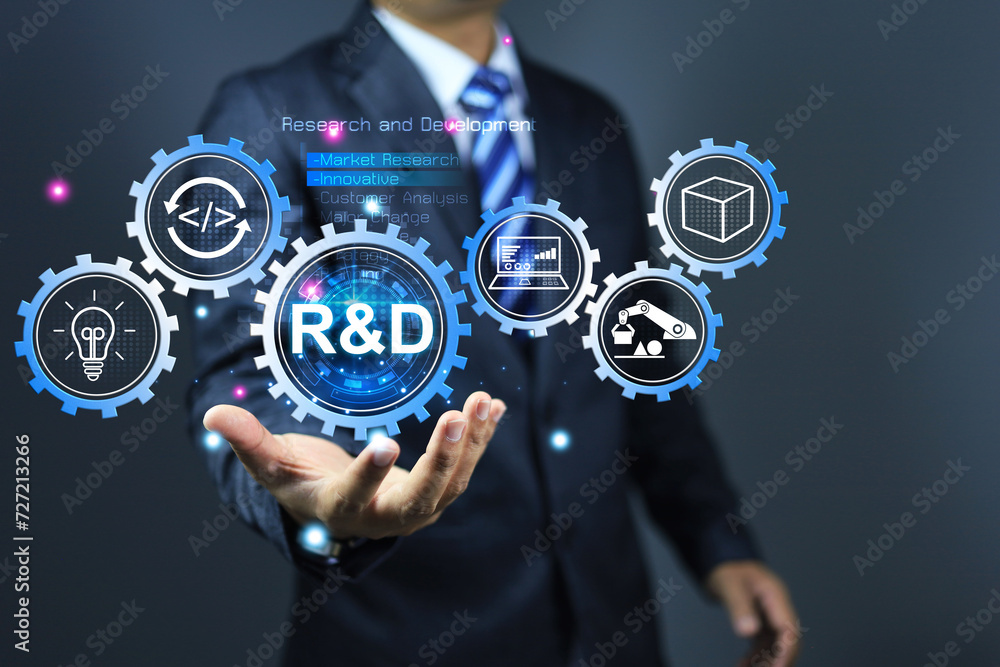 Research and development concept with businessman holding r and d gear system process to continue product improvement and development from start to finish products Research and development concept with businessman holding r and d gear system process to continue product improvement and development from start to finish products