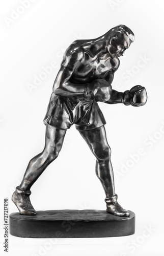 A purchased (consumer) figure of a Boxer made of cast iron in close-up on a white background