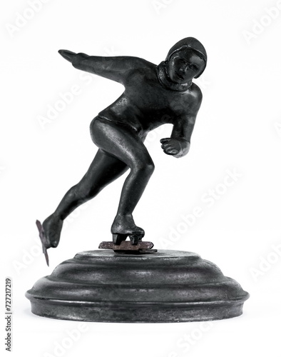 A purchased (consumer) figure skater made of cast iron in close-up on a white background
