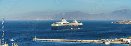 Cruise Ship at the southern Aegean Sea near coast of Mykonos island. Greece photo