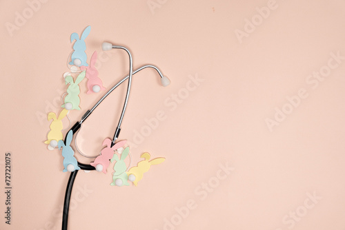 Medical Easter banner on peach color background, blank with space for text, top view. photo