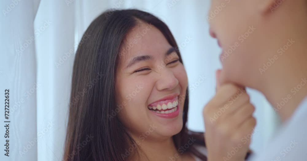 Happiness moment, Young asian couple with happy expression in bedroom at home. They enjoying together with this moment. Happiness moment, Young asian couple with happy expression in bedroom at home. They enjoying together with this moment.