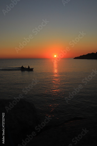 sunset with fisherman