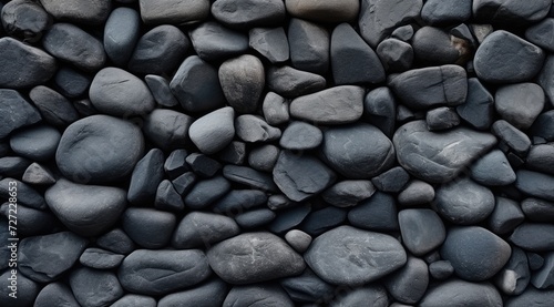 Predominantly black pebble concrete texture enhanced by scattered grey pebbles, creating a striking visual contrast.