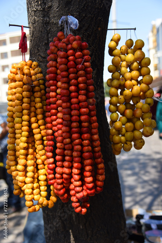 red and yellow hawtorn fruits, hangind on tree photo