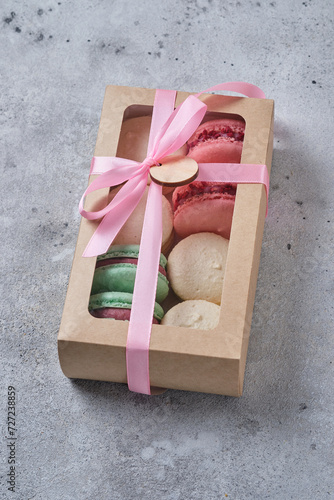 A box with classic French macarons. Delicious and beautiful cakes.