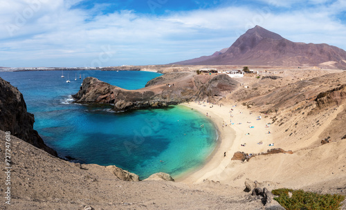 Aerial view of Playa de Papagayo beach, with blue clean water and white sand, this is one of the most beautiful place in Lanzarote, Canary Islands - Spain