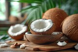 A fresh coconut on a wooden table, half-open, revealing its nutritious and delicious content.
