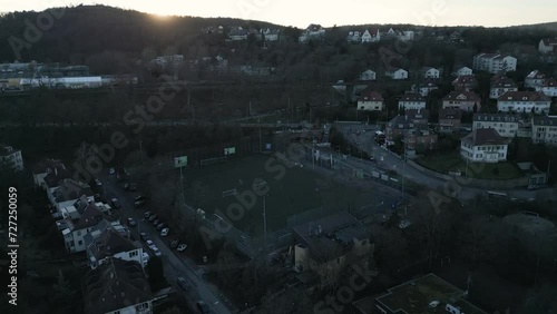 Drohnenflug über einem Fussballfeld während einem Sonnenuntergangs in Stuttgart, Deutschland. photo