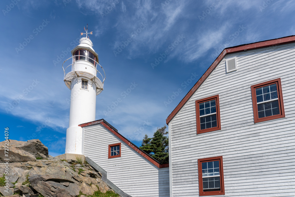 Lobster Cove Head Lighthouse at Gros Morne National Park in Newfoundland, Canada. Overlooking the Gulf of St Lawrence, Bonne Bay and Rocky Harbor. Visitor center with cultural and historical exhibits 