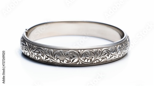 A single silver bracelet with intricate details isolated on white