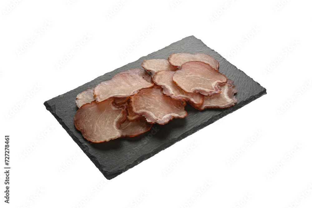 Φωτογραφία Embutido de lomo de cerdo cortado en rodajas en un plato de piedra negra
