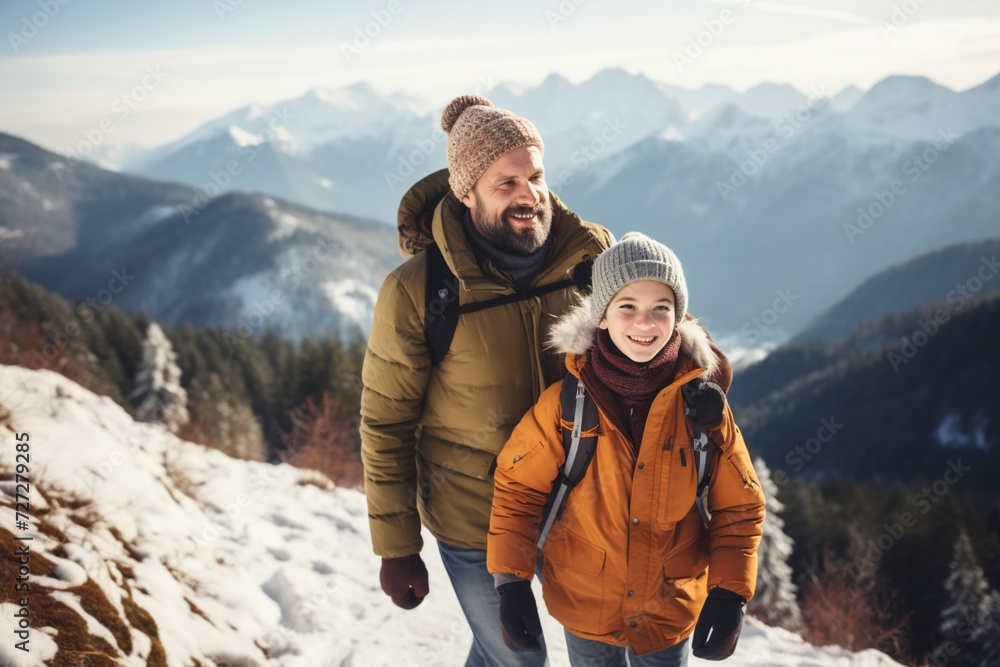 Father and son hiker travel, walk in winter snowy mountains