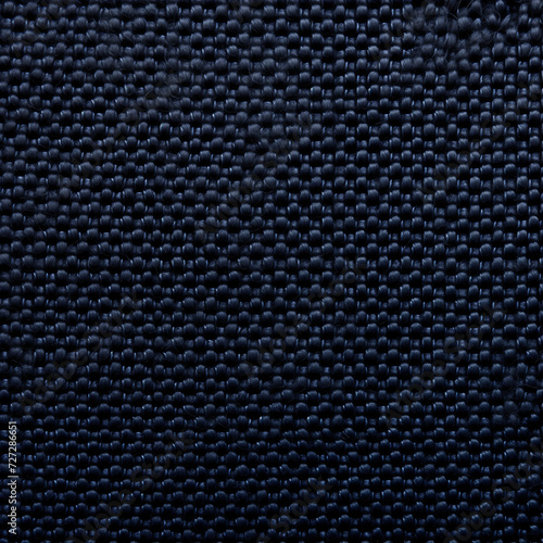 Close-up texture of a dark blue braided fabric with a detailed weave pattern