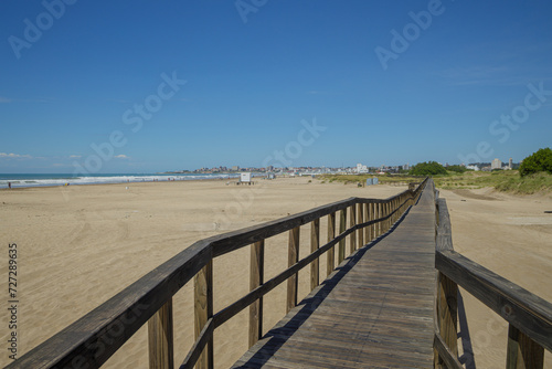 Wooden walkway on the beach of the port of Mar del Plata.