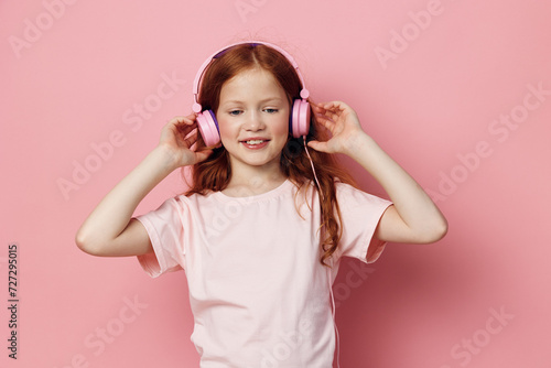 Enjoy listen kid song childhood small girl sound headphone cute little young children music