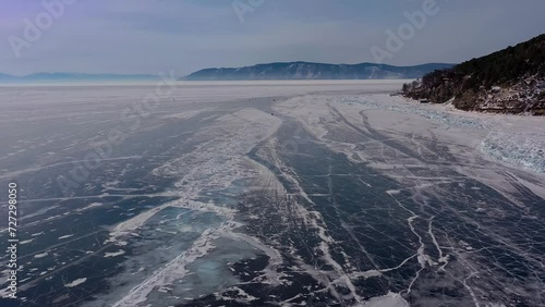 Wallpaper Mural Aerial drone view frozen winter Lake Baikal. Blue transparent ice deep cracks top view. Natural cold background of ice. Winter abstract background. High quality 4k footage Torontodigital.ca