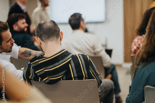 Engaged audience at interactive workshop in modern conference room.