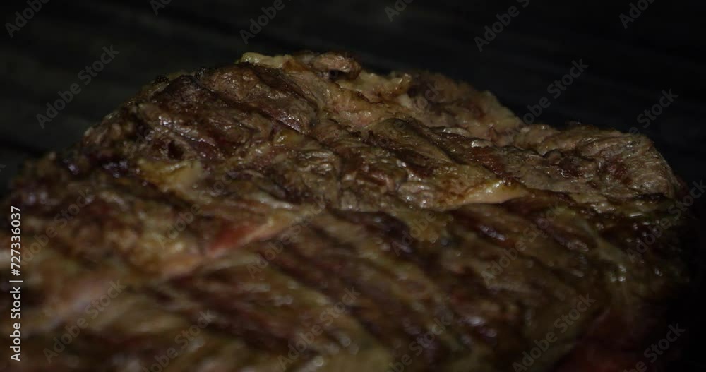 cooking several pieces of meat on a grill cooking several pieces of meat on a grill