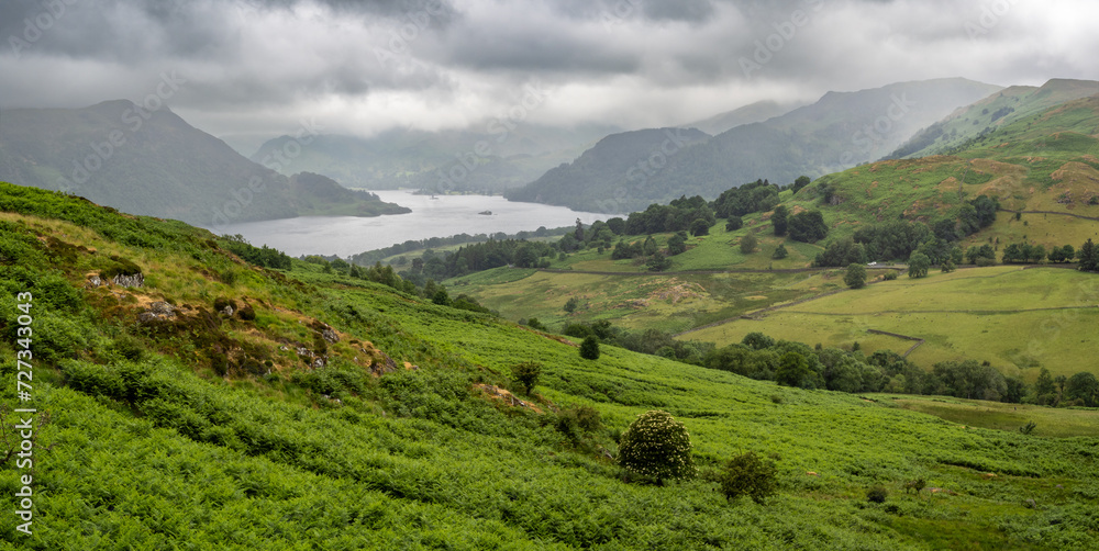 Ullswater lake and meadows in Lake district, England