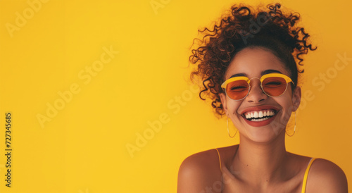 happy smiling young black woman with afro hair. Spring portrait of excited young woman. Happy African woman in glasses looking at camera, smiling.