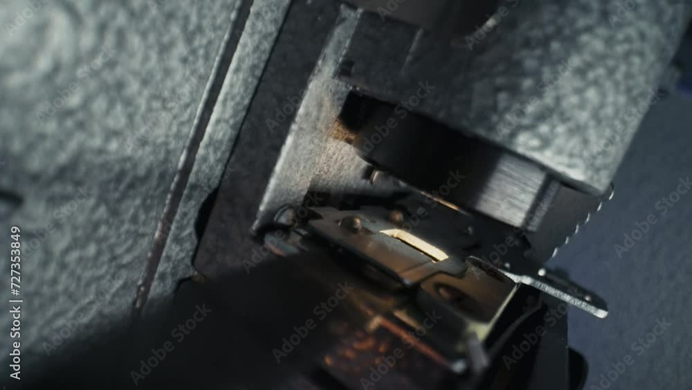Macro working process of 8mm film projector rotating filmstrip reels. Mechanism Macro working process of 8mm film projector rotating filmstrip reels. Mechanism