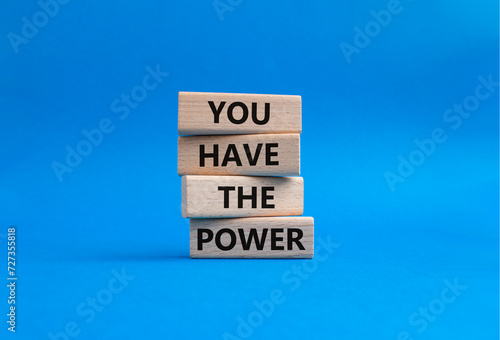 You have the Power symbol. Concept words You have the Power on wooden blocks. Beautiful blue background. Business and You have the Power concept. Copy space.