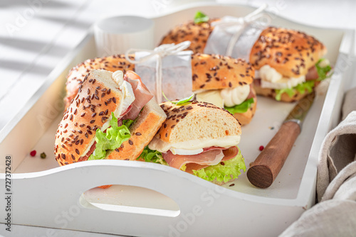 Healthy sandwich made of ham, cheese and vegetables.